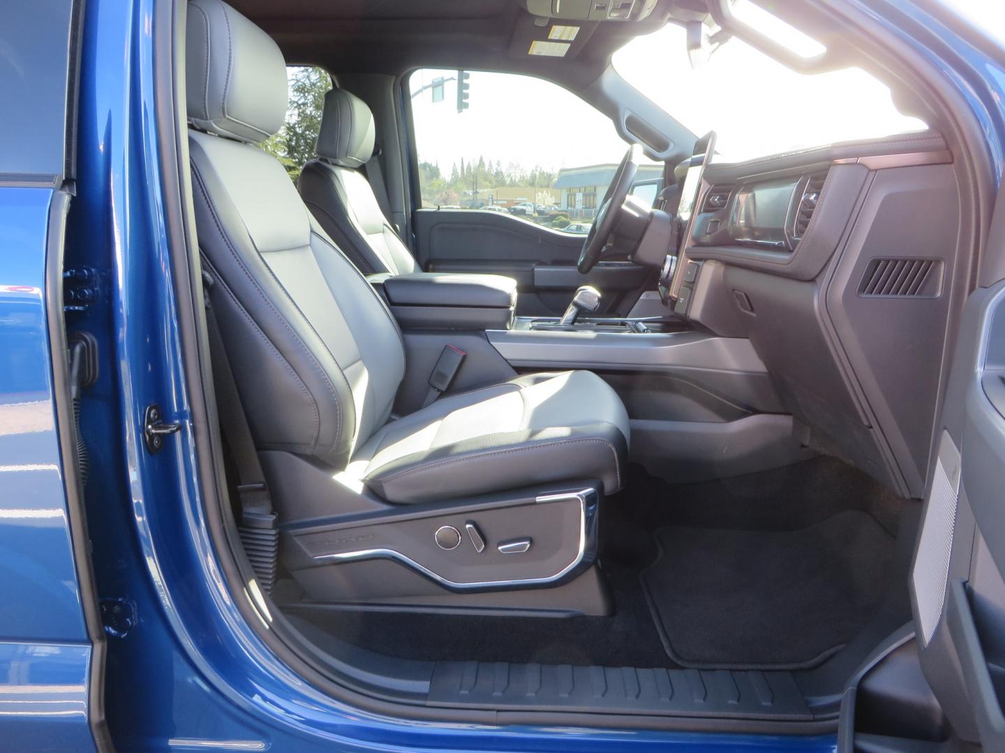 2022 BLUE /BLACK Ford F-150 Lariat Crew Cab 4WD (1FT6W1EV6NW) , located at 2630 Grass Valley Highway, Auburn, CA, 95603, (530) 508-5100, 38.937893, -121.095482 - Tired of gas prices and still want to look cool? Check out this Ford Lightning featuring a RC level kit, Nitto Ridge Grappler tires, Fuel Rebel wheels, Sinister front and rear bumpers, Baja Designs leds, Rigid Industries Leds, Bakflip F1, and window tint. - Photo#65